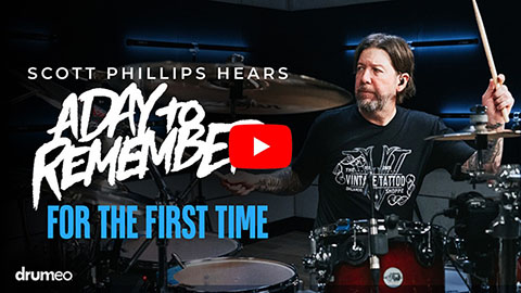 a still frame of a YouTube video of the drummer from Creed playing drums